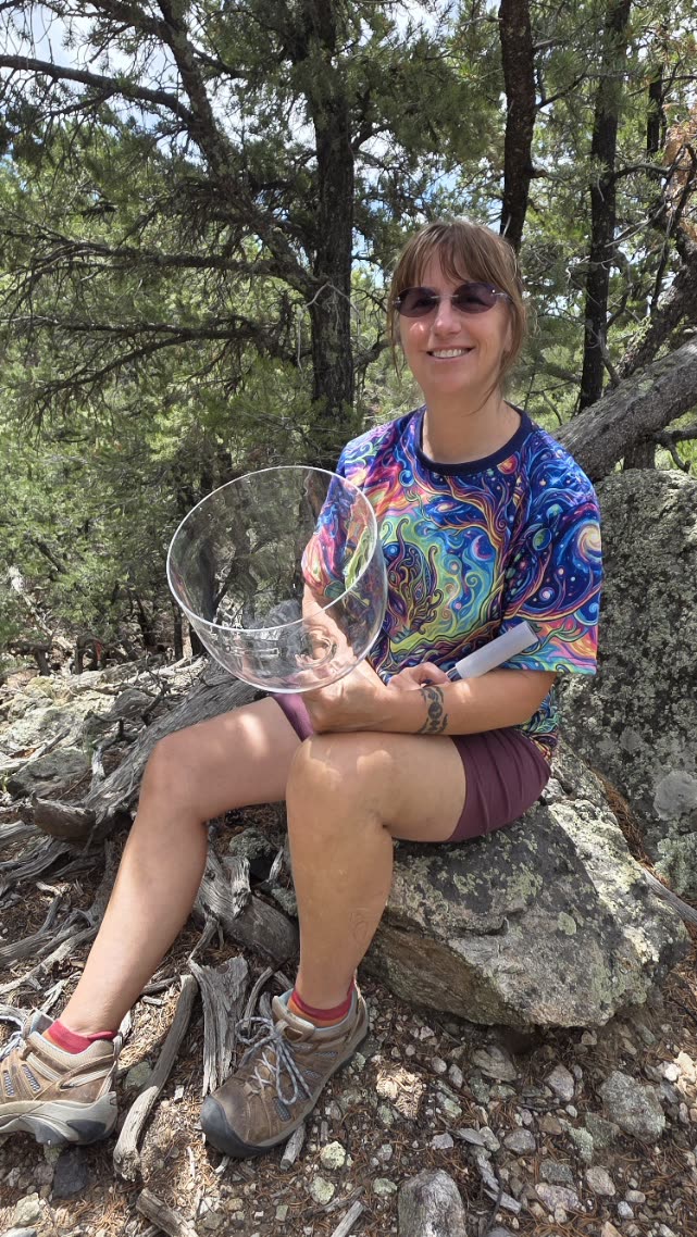 Melissa with a crystal singing bowl in the Crestone hills